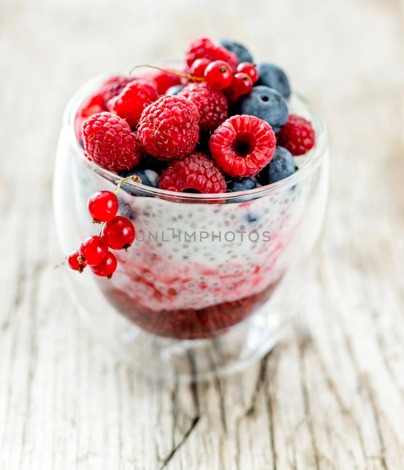 Dessert from yogurt with chia seeds, raspberries and blueberries by tan4ikk1