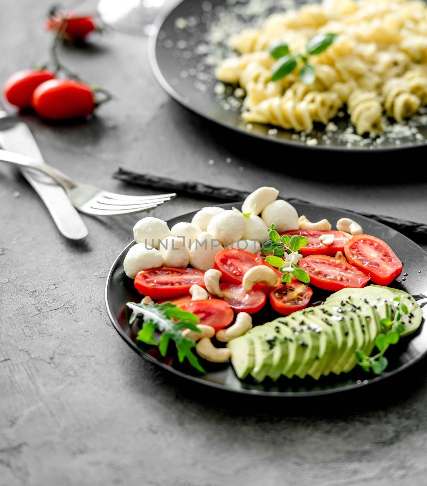 vegetarian dinner: vegetables and pasta with parmesan cheese and herbs by tan4ikk1
