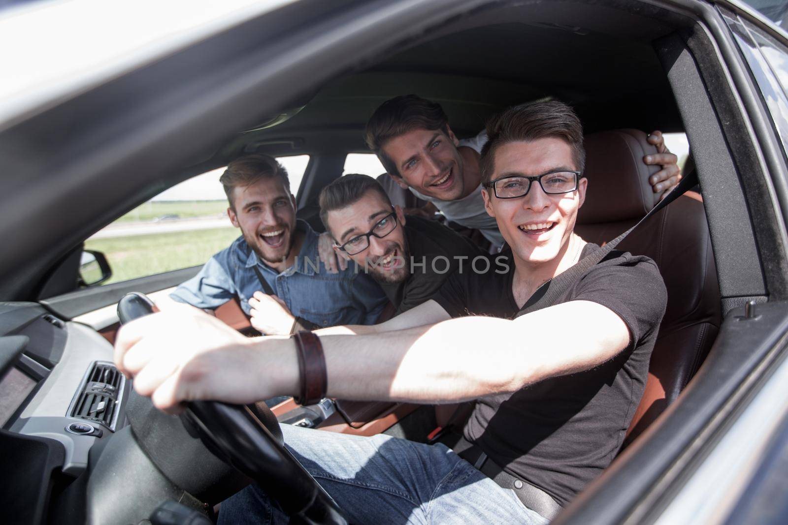 Group Of Friends In Car On Road Trip Together by asdf