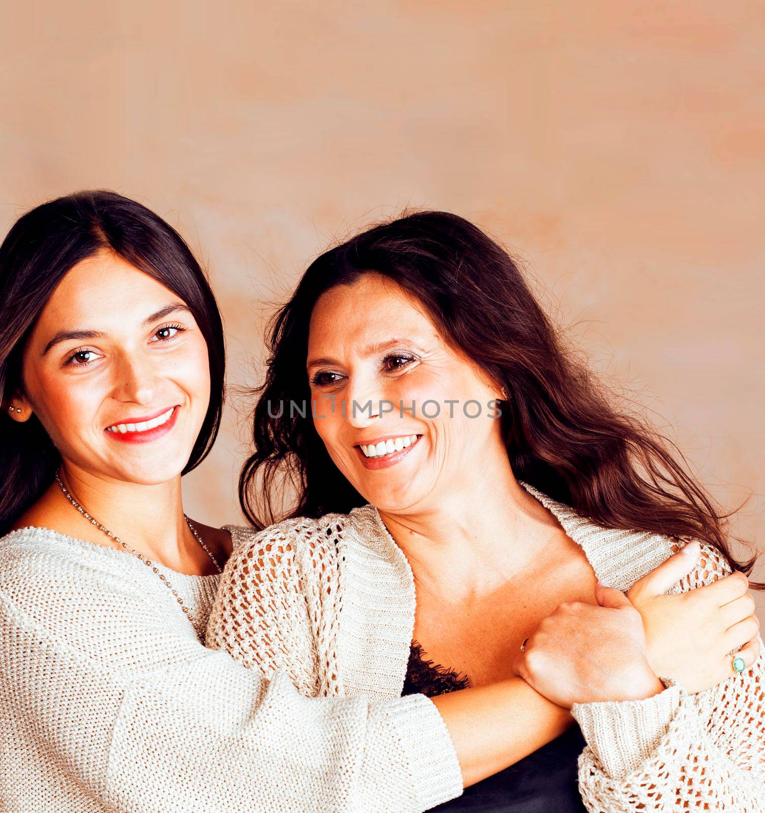 cute pretty teen daughter with mature mother hugging, fashion style brunette makeup close up tann s together, warm colors by JordanJ