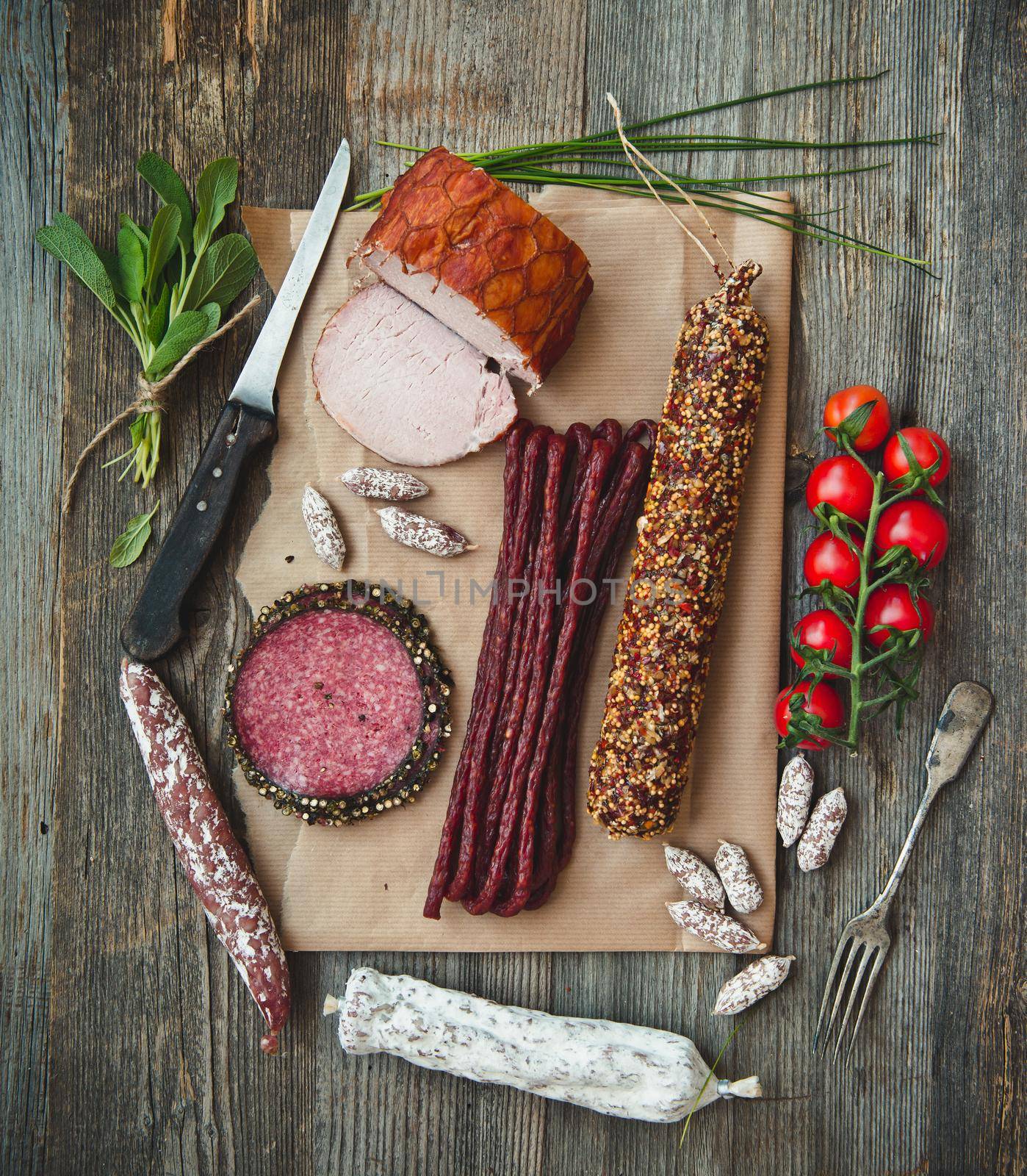 Assortment of cold meats over wooden background