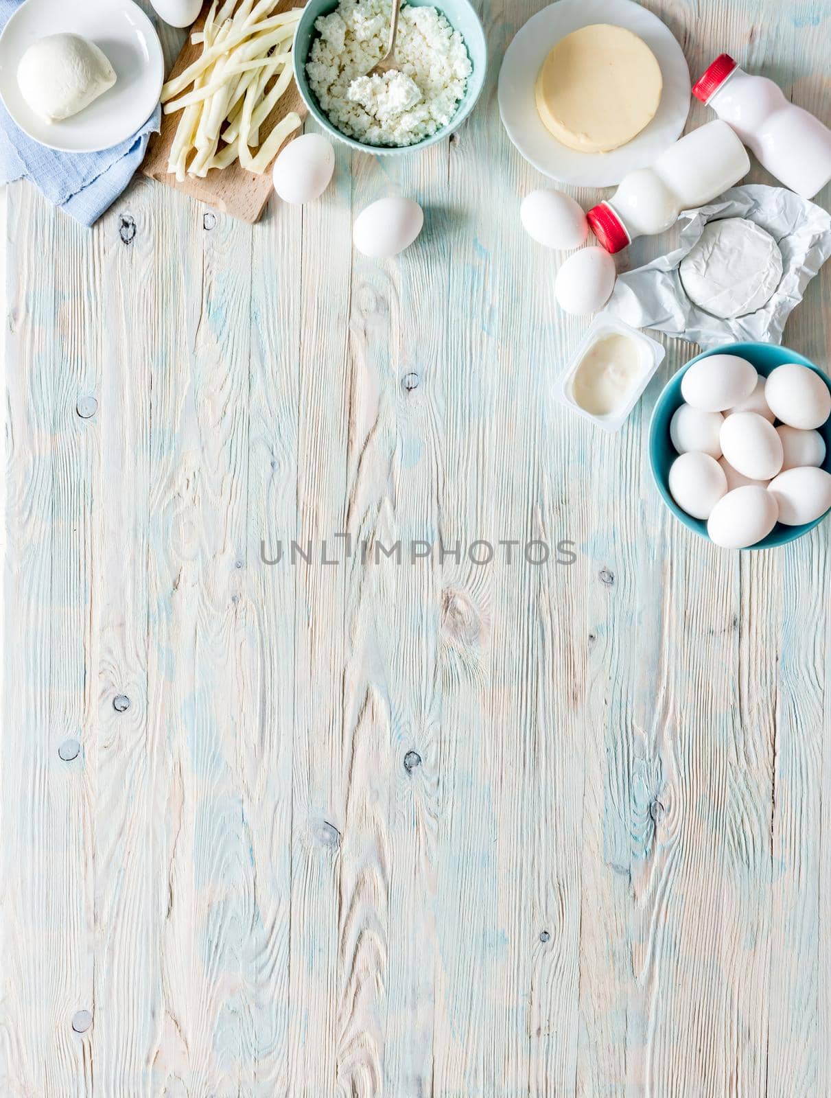 set of dairy products on wooden background with text space top view