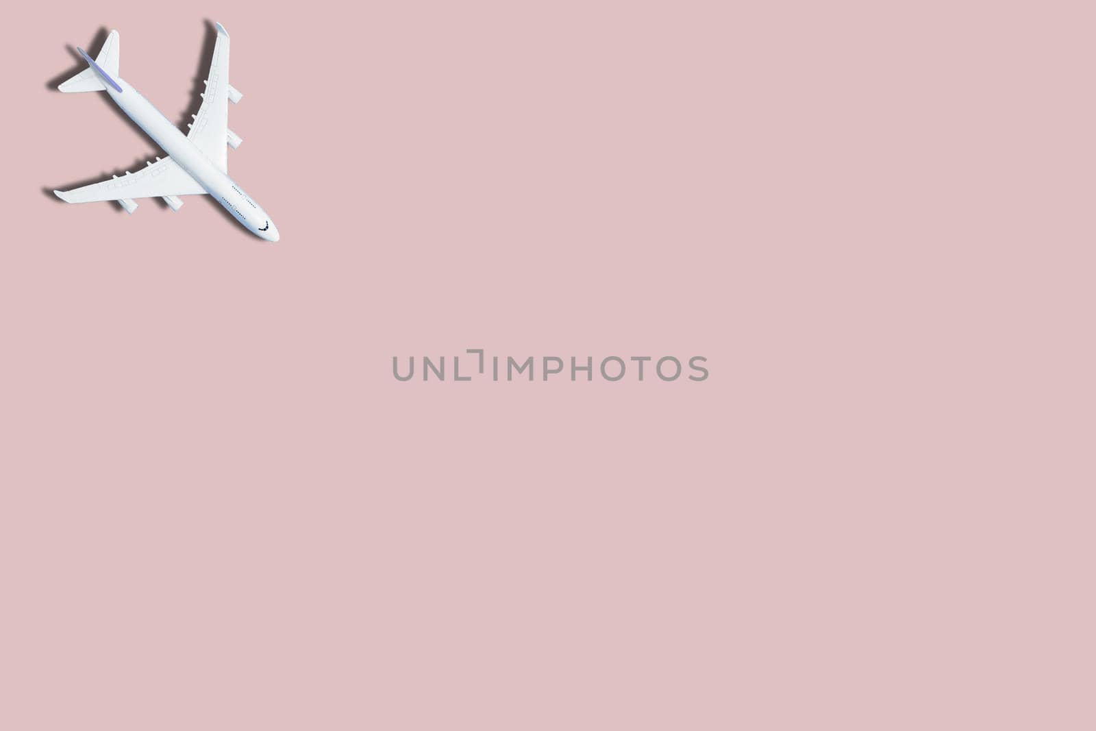 airplane figure on pink background 3d rendering by Andelov13