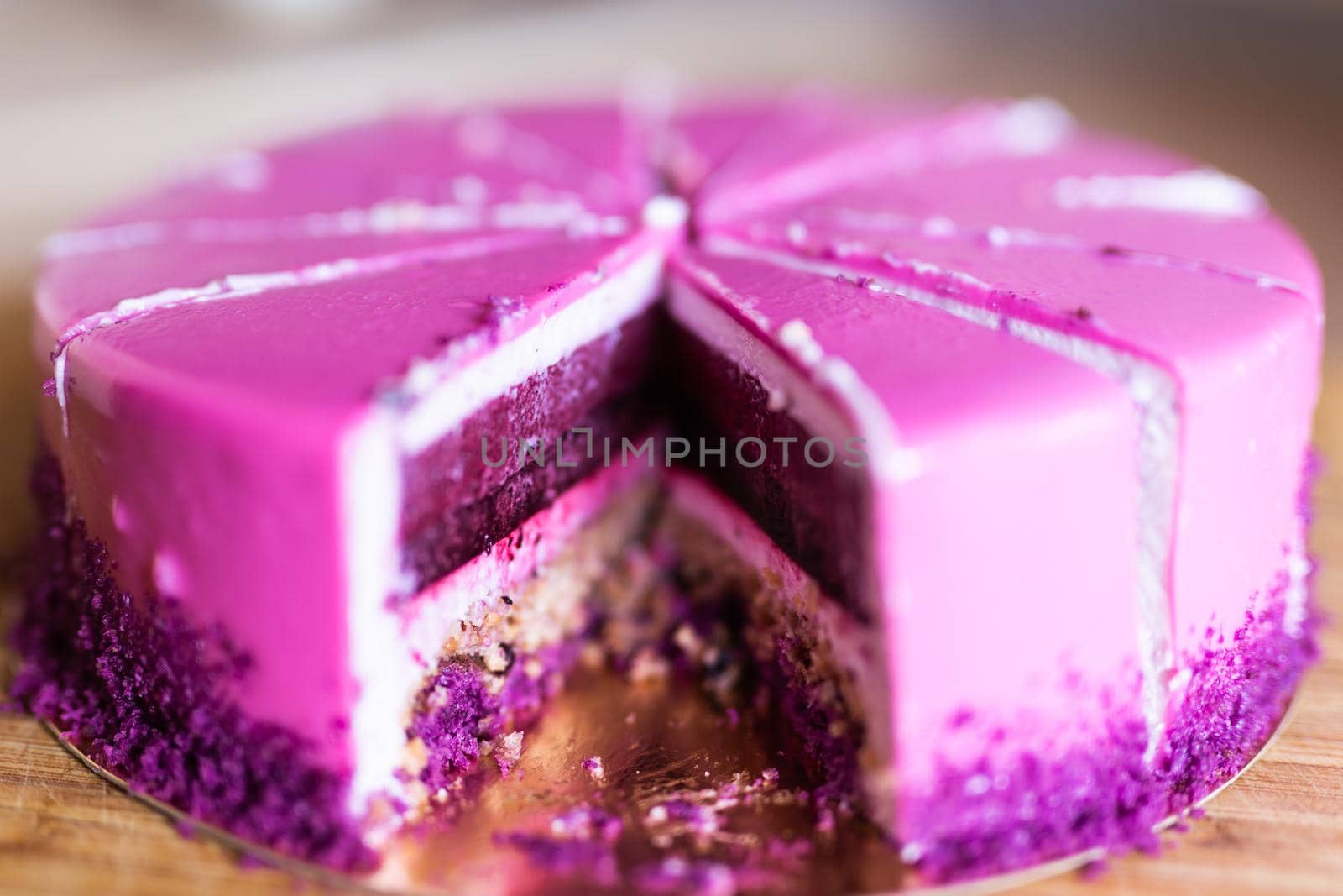 Pink and violet birthday cake without one piece. Dessert, holidays and delicious concept. by Satura86
