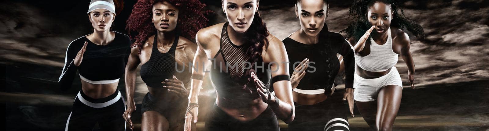 Group of five strong athletic women, sprinters, running on dark background wearing in the sportswear, fitness and sport motivation. Runner concept. by MikeOrlov