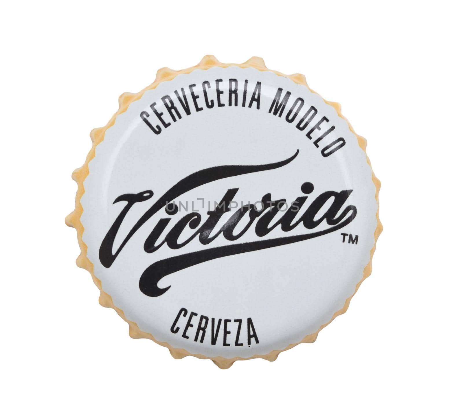 IRVINE, CALIFORNIA - 4 JUNE 2020: Closeup of a Victoria beer bottle cap on white. by sCukrov