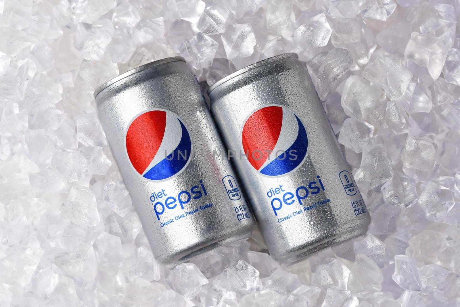 IRVINE, CALIFORNIA - 26 JUNE 2021: Two cans of Diet Pepsi in a bed of ice. by sCukrov