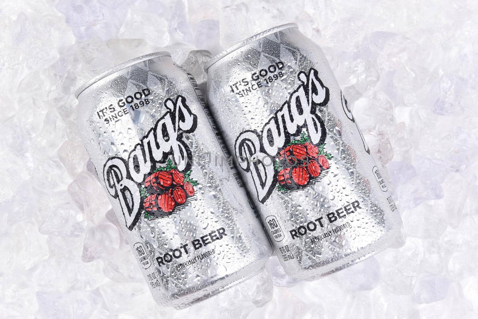 IRVINE, CALIFORNIA - JULY 10, 2017: Two Barqs Root Beer Cans on a bed of ice with condensation. Created by Edward Barq and still owned by the Barq family but bottled by the Coca-Cola Company.