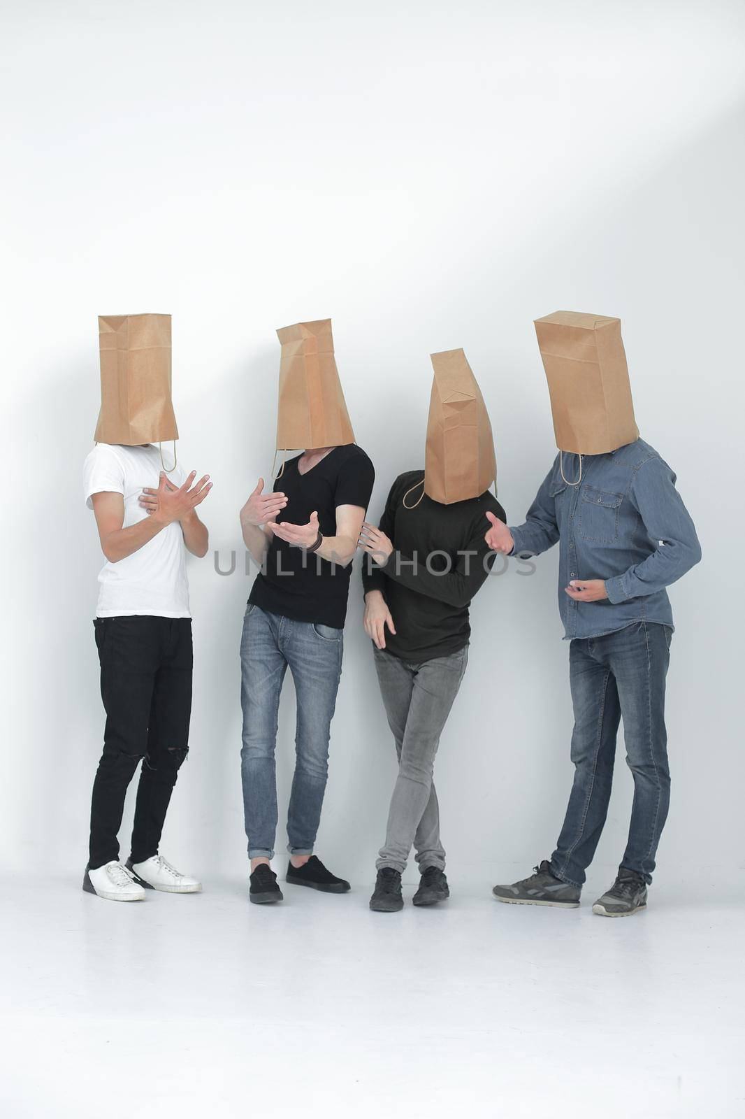 group of young people with paper bags on their heads by asdf