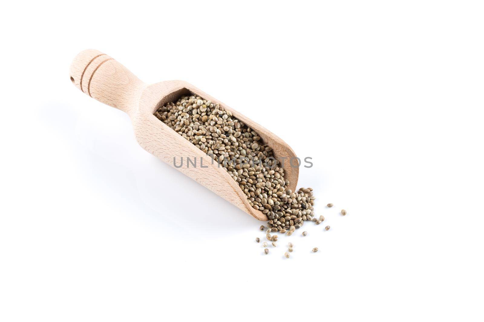 Cannabis Hemp seeds in wooden scoop close up macro shot isolated on white background