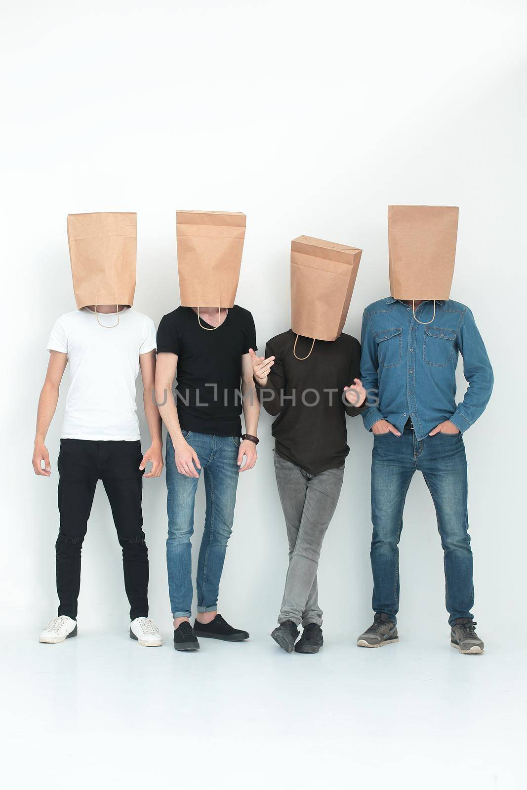 in full growth. a group of men with paper bags on their heads.photo with copy space