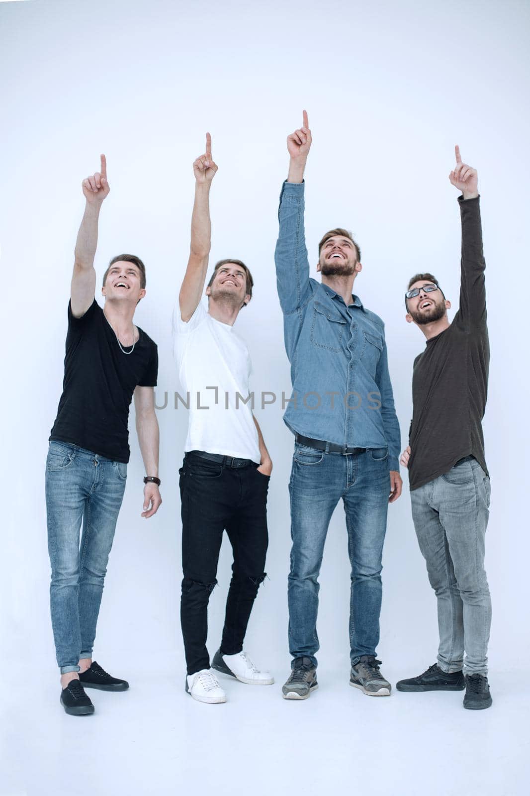 group of young people points up.isolated on white background