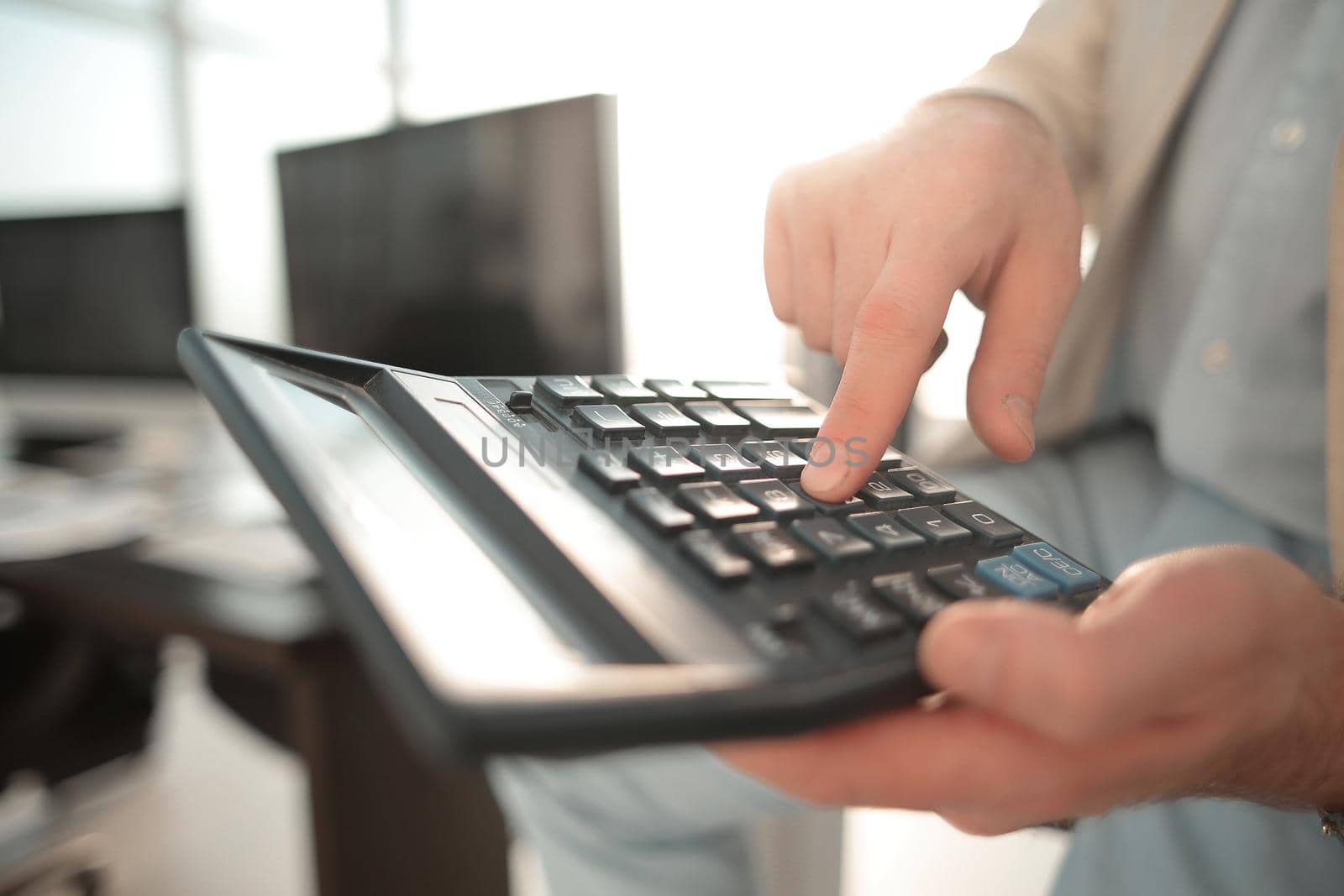 close up. businessman using calculator .business concept