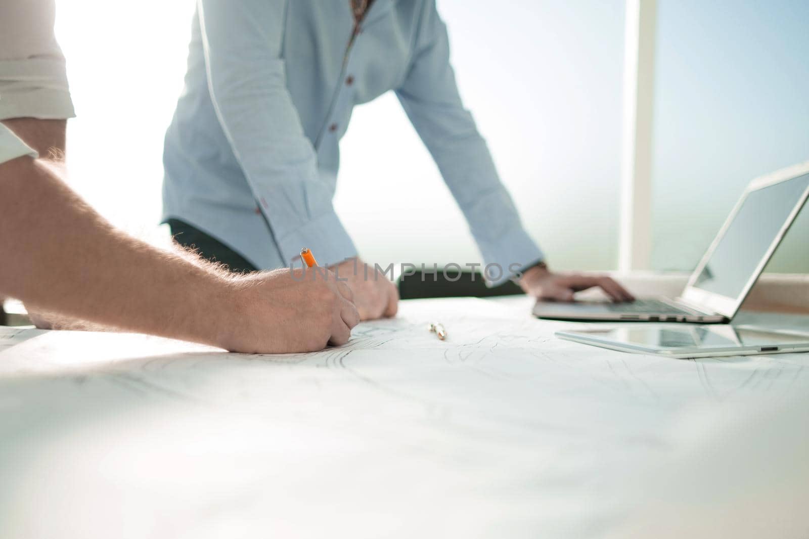 background image of architects standing at the Desk.photo with copy space