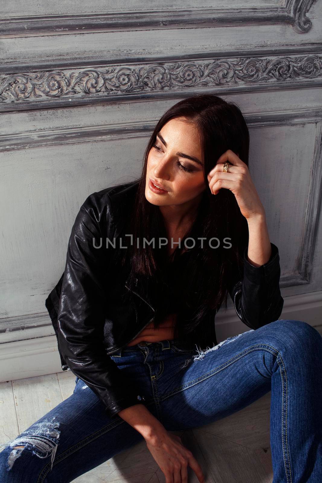 young brunette woman in leather jacket at vintage wall, lifestyle people concept by JordanJ