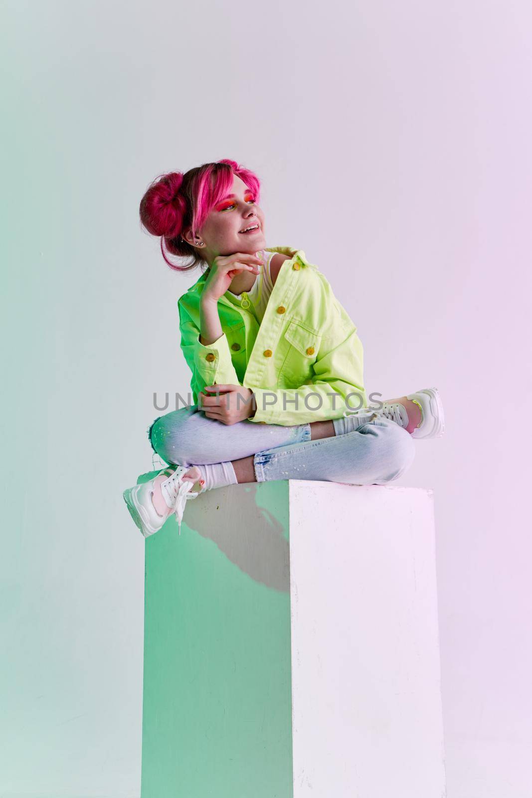 glamorous fashionable woman with pink hair posing hipster neon. High quality photo