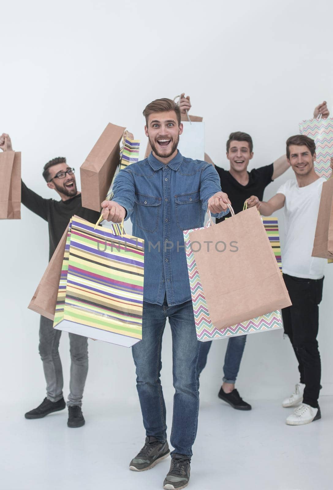 group of cheerful young people with shopping bags.photo with text space