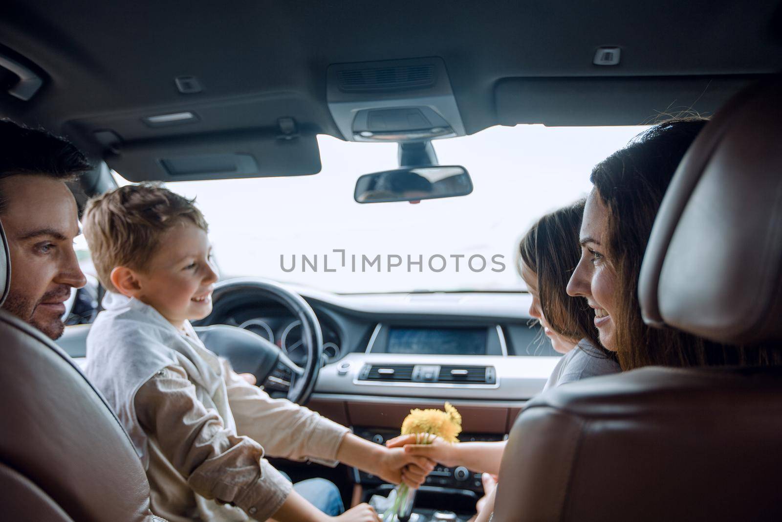 close up. family relaxing in a comfortable car by asdf