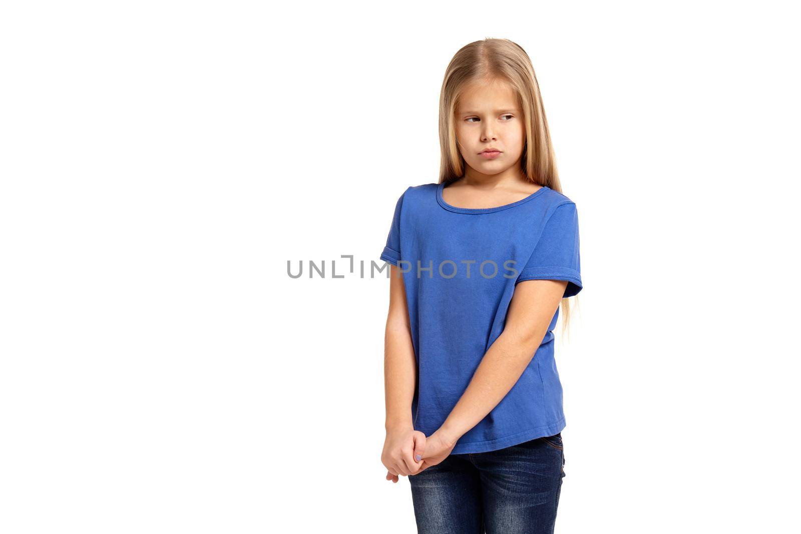 Portrait of adorable little girl isolated on a white background. in blue t-short with long white hair, shying stand