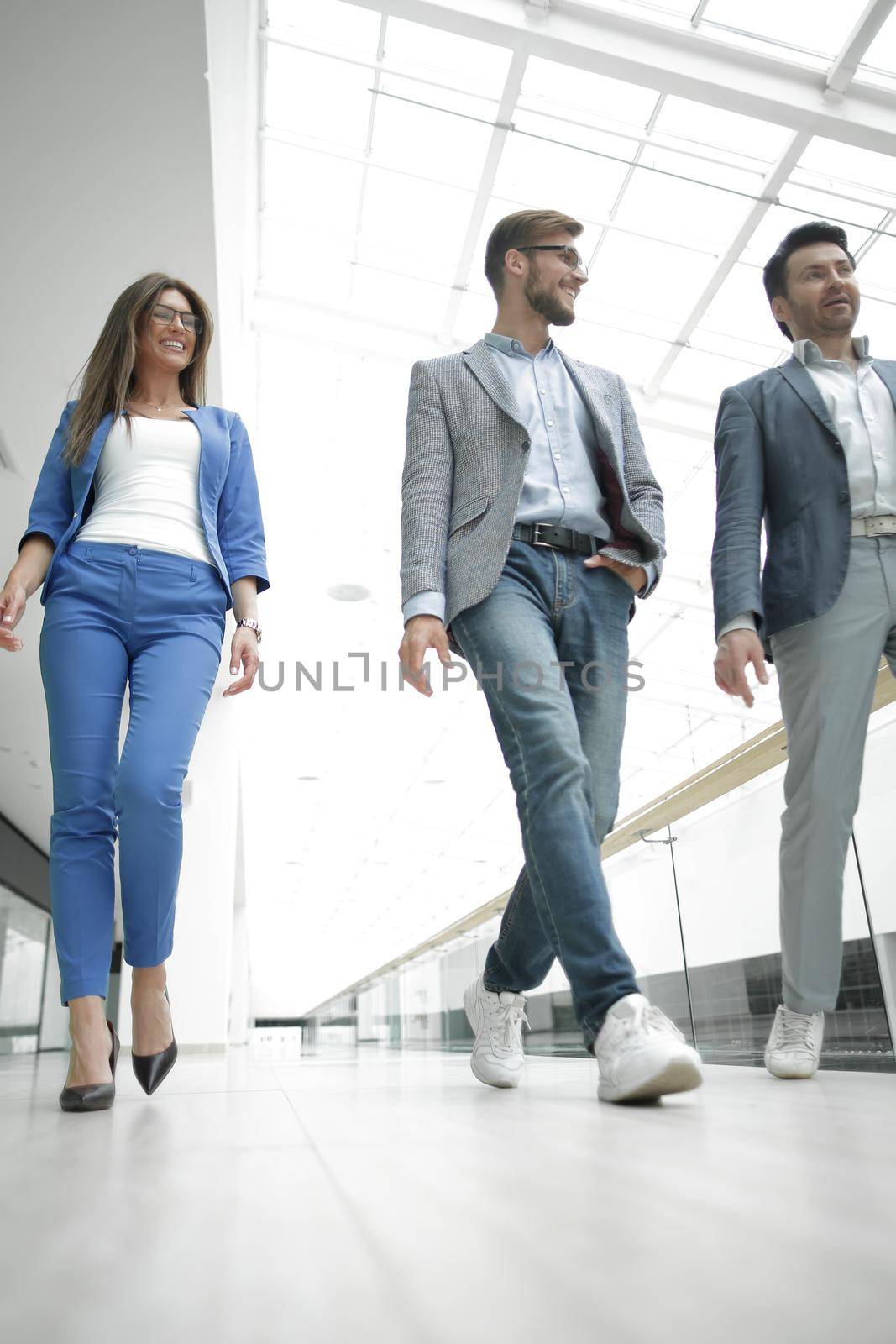 Business people walking in the office corridor.business concept
