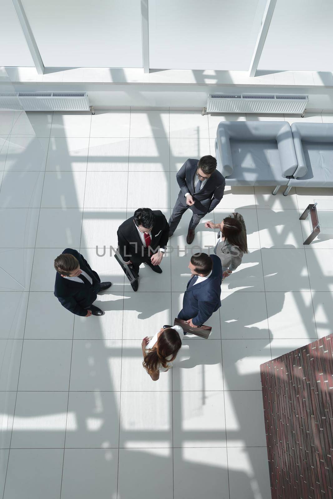 top view.a group of business people standing on a marble floor. by asdf