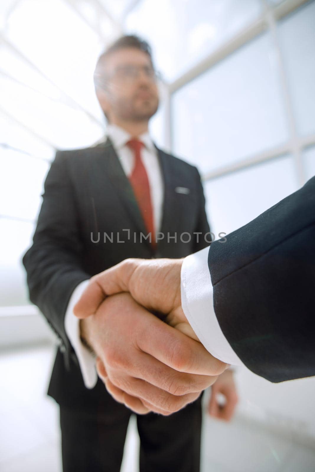 business background.confident handshake of business people.the concept of cooperation