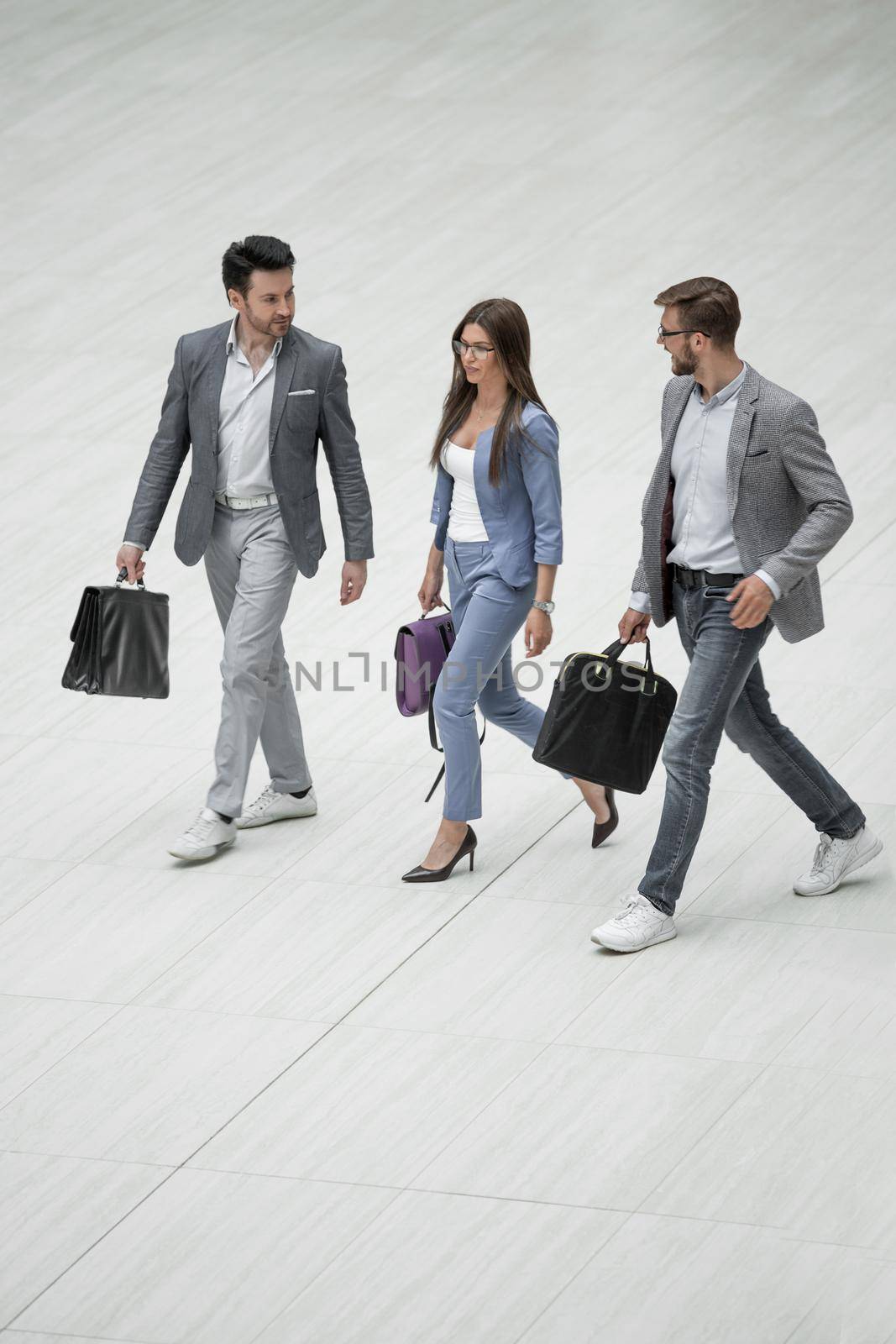 business people walking together by asdf