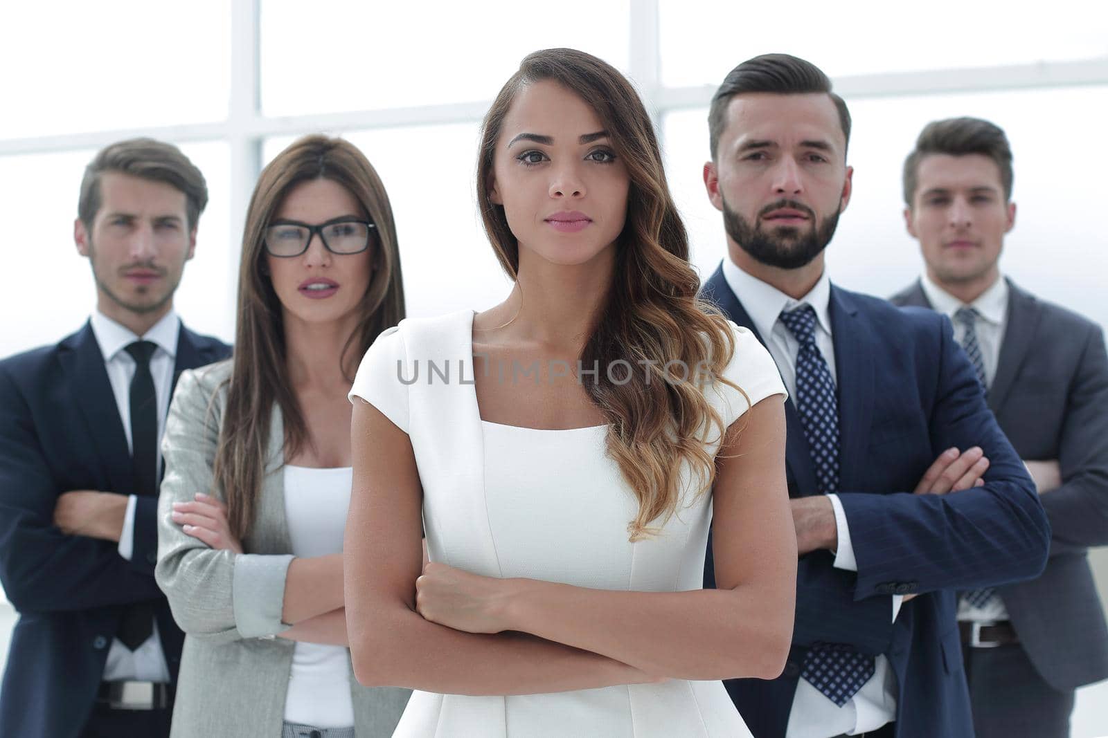 young business woman in front of the business team. the concept of teamwork