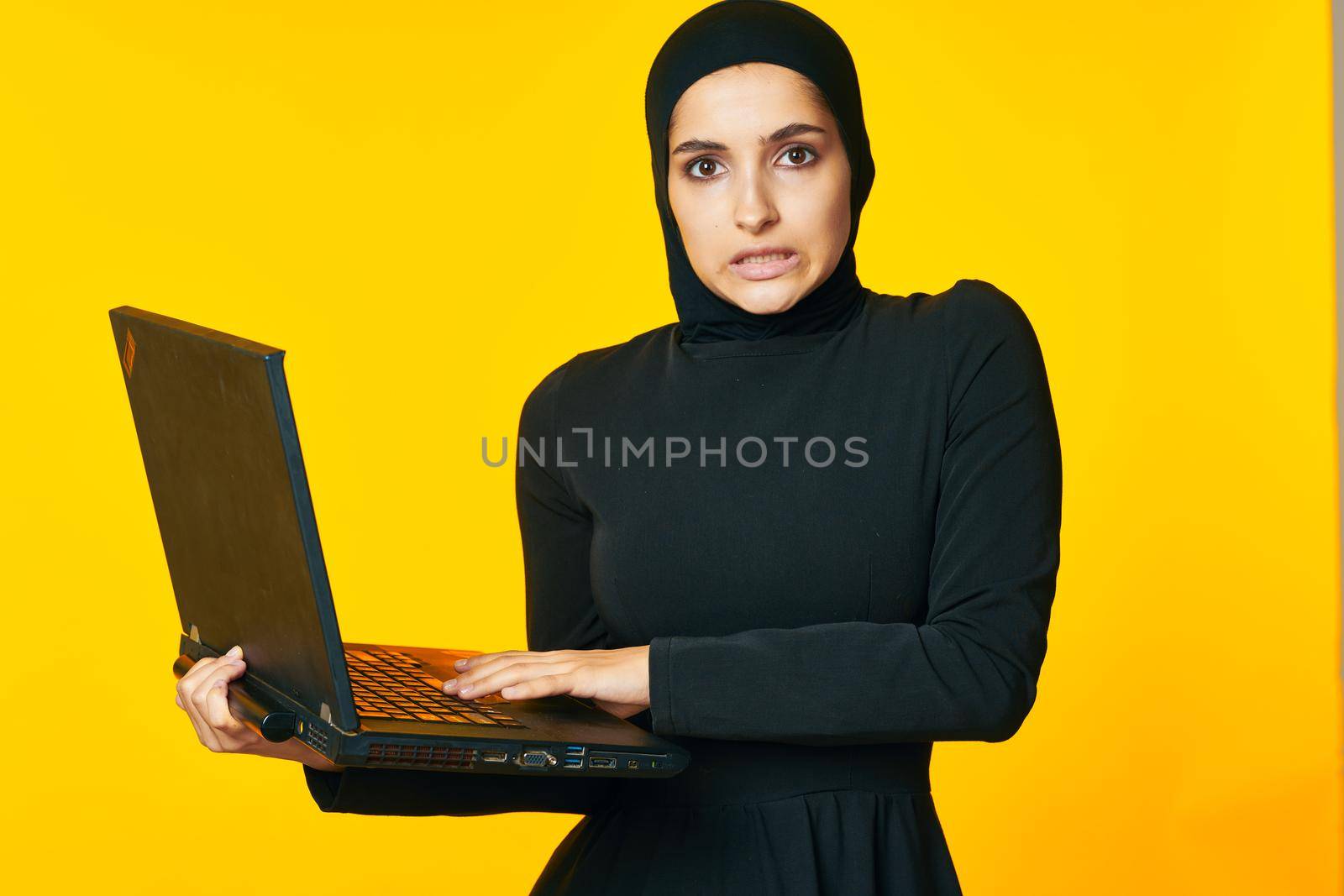 cheerful woman laptop in hands learning student emotions ethnicity model by Vichizh