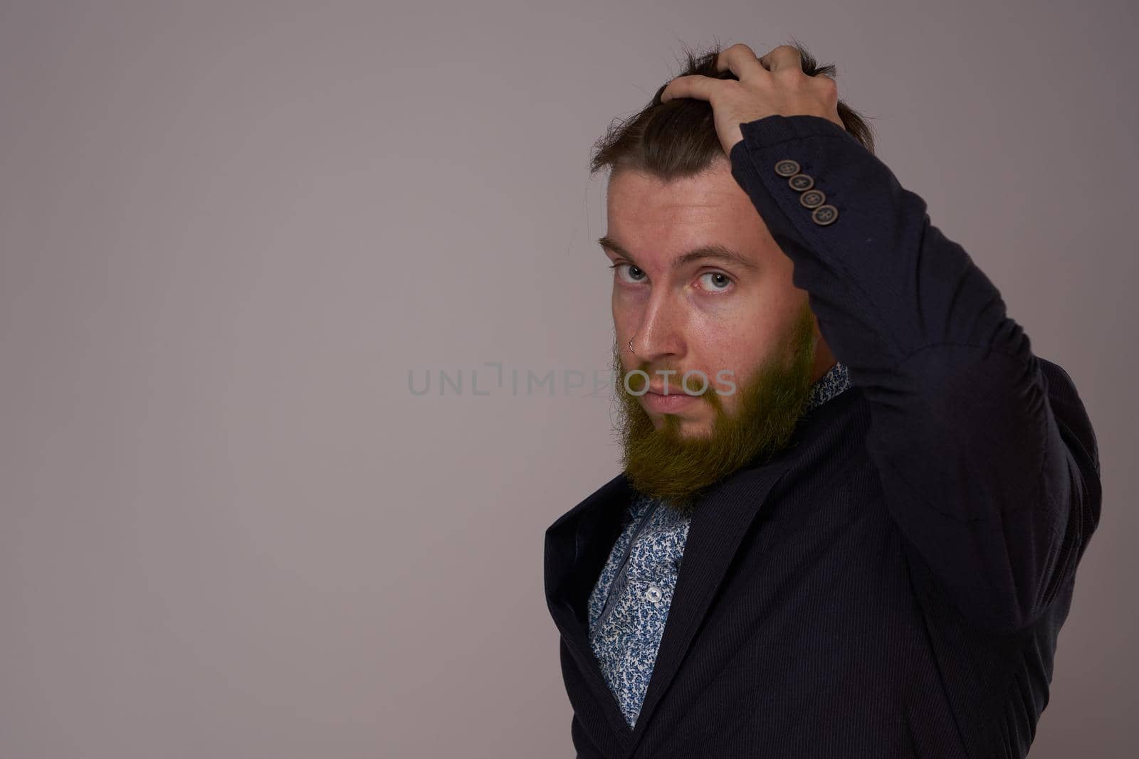 handsome bearded man in jacket fashion posing close-up. High quality photo