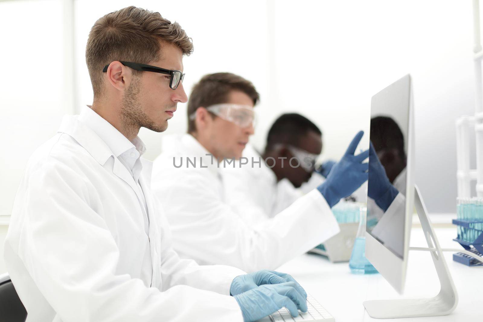 group of scientists conduct laboratory studies.science and technology