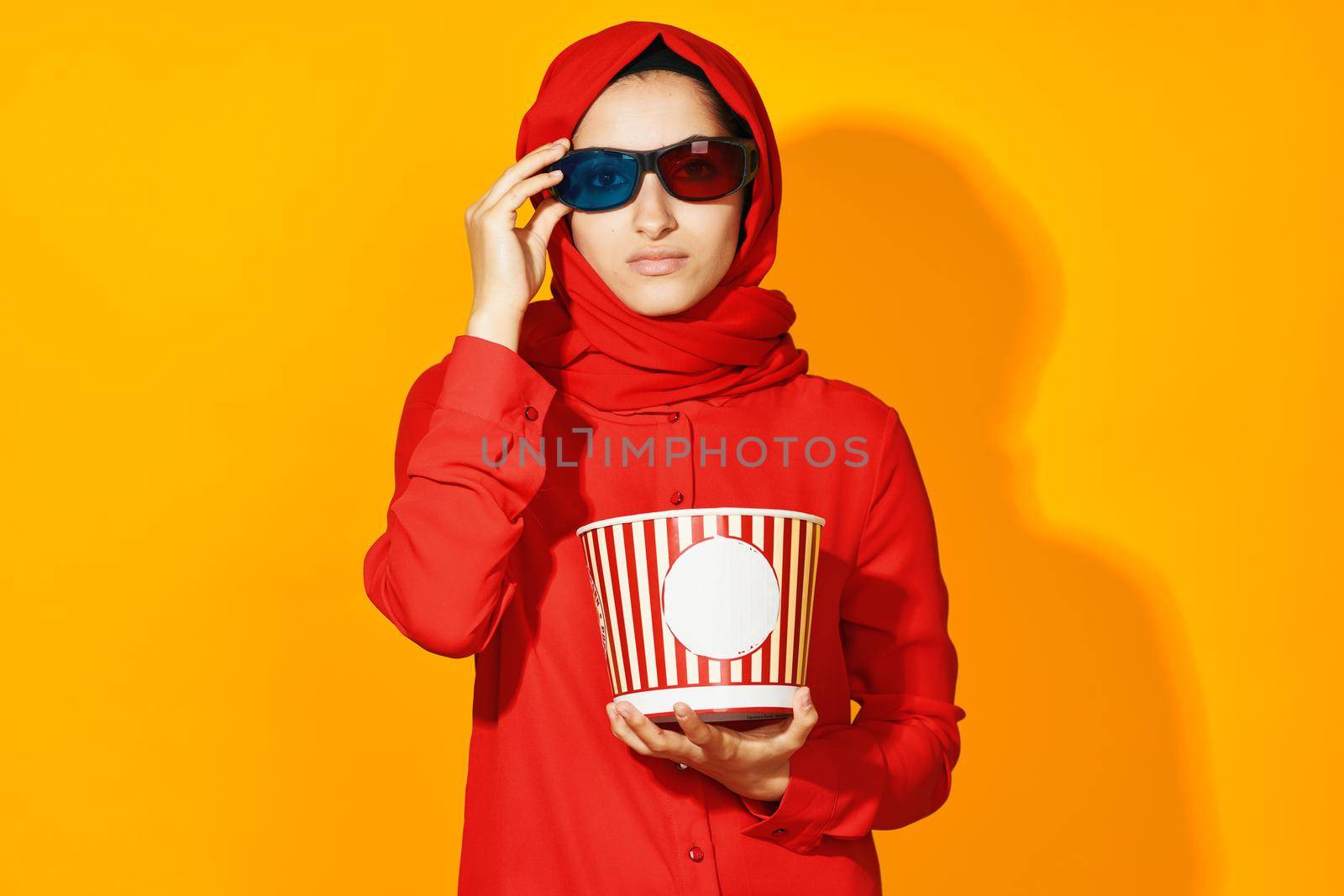 woman in red hijab virtual reality movie fashion fun movie isolated background. High quality photo