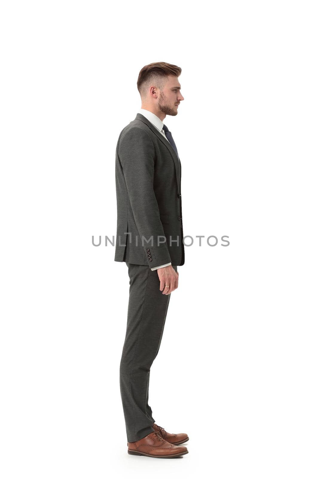 side view.portrait in full growth. confident businessman.business people