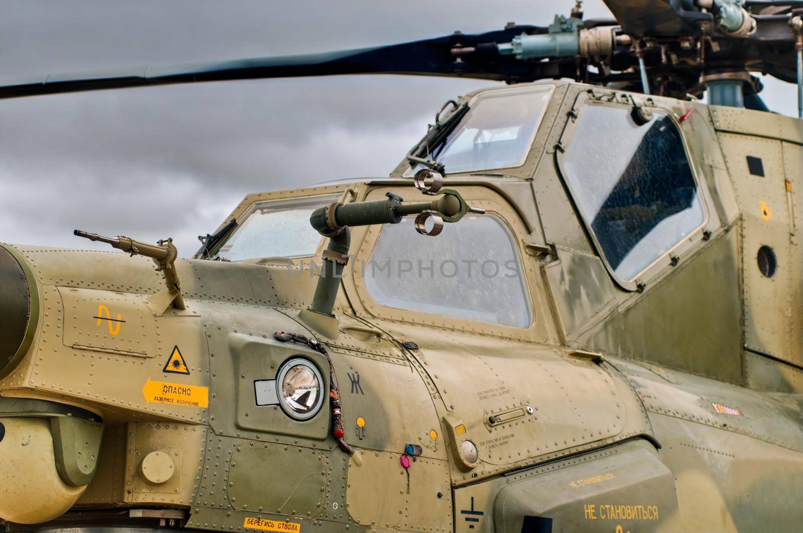 military helicopter cockpit details with sky in background