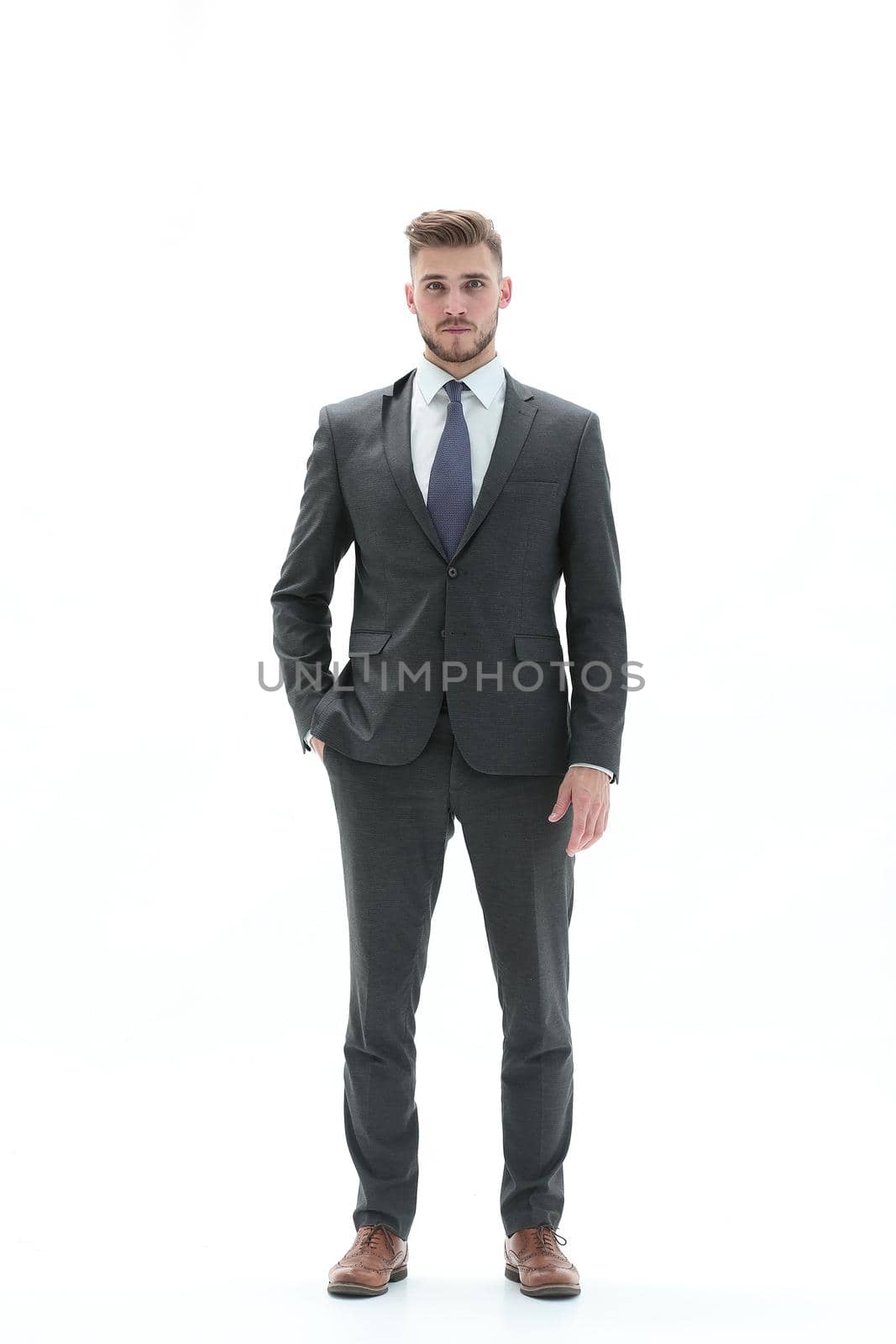 in full growth.portrait of a modern young businessman.isolated on white