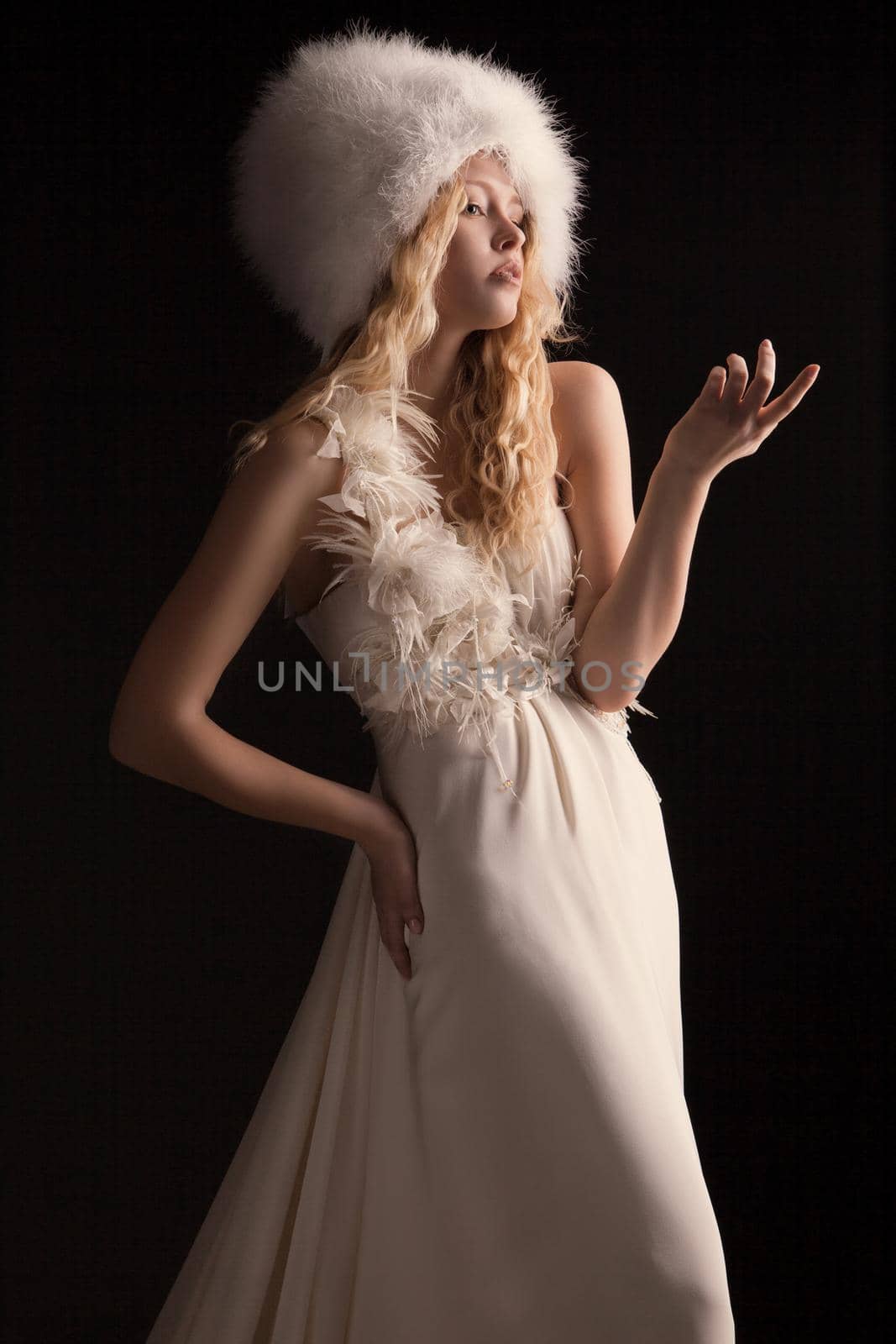 The beautiful young woman in a wedding dress by Julenochek