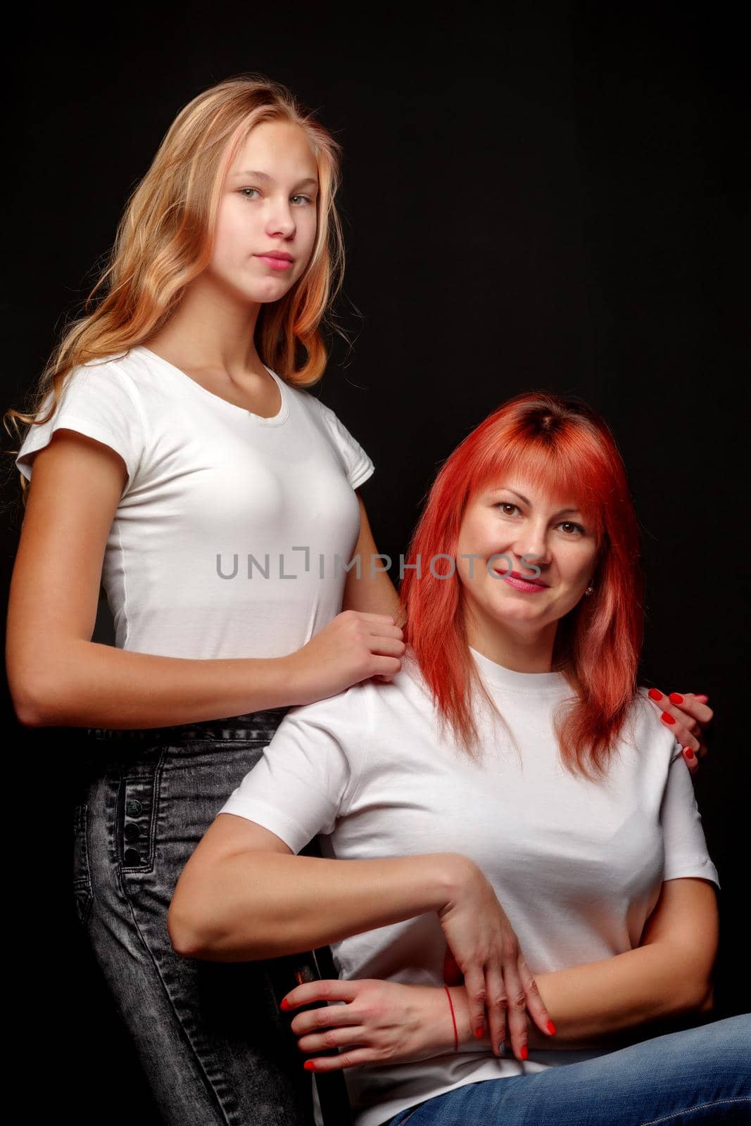 mother and little daughter gently embrace by kolesnikov_studio