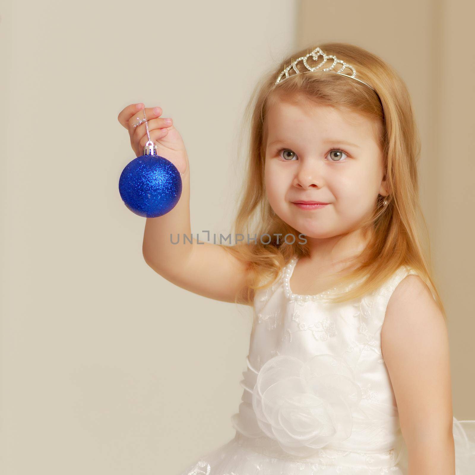 Cute little girl with christmas tree toy. New Year's concept, children's holidays.
