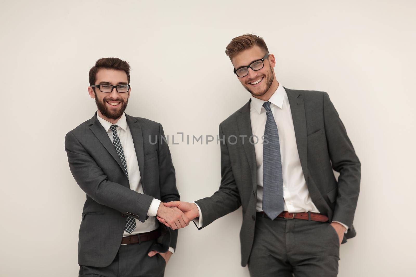 handshake of two business people.isolated on light background