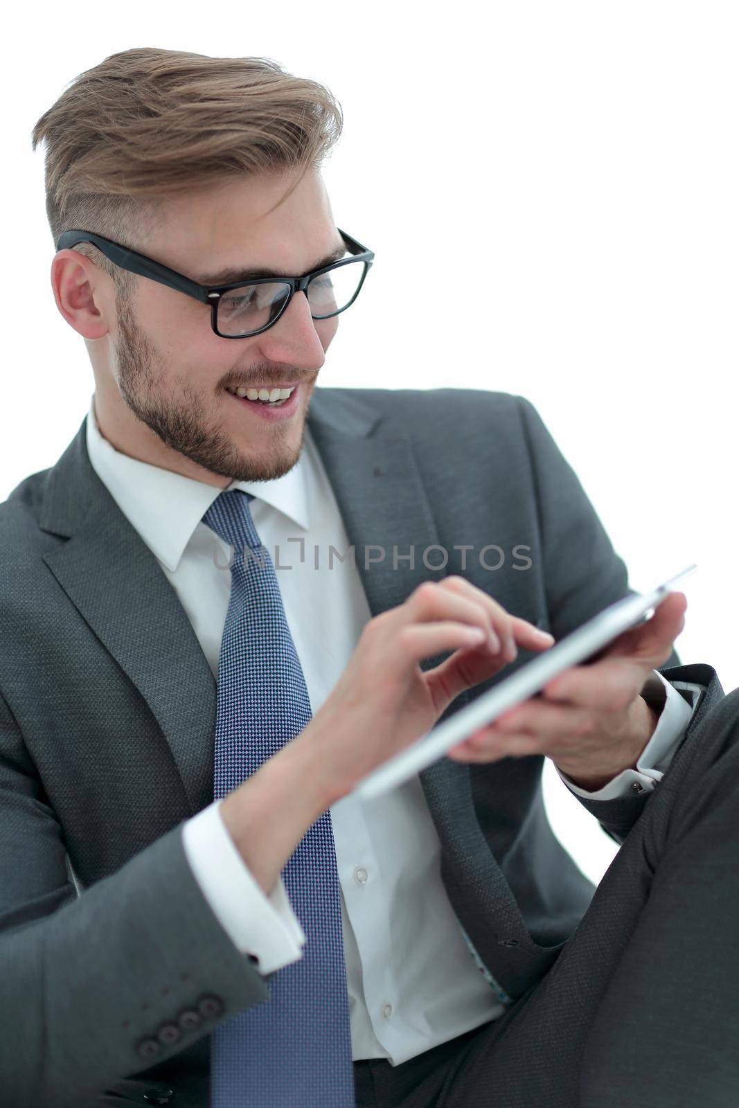 close up.attentive businessman clicking on the screen of the digital tablet. by asdf