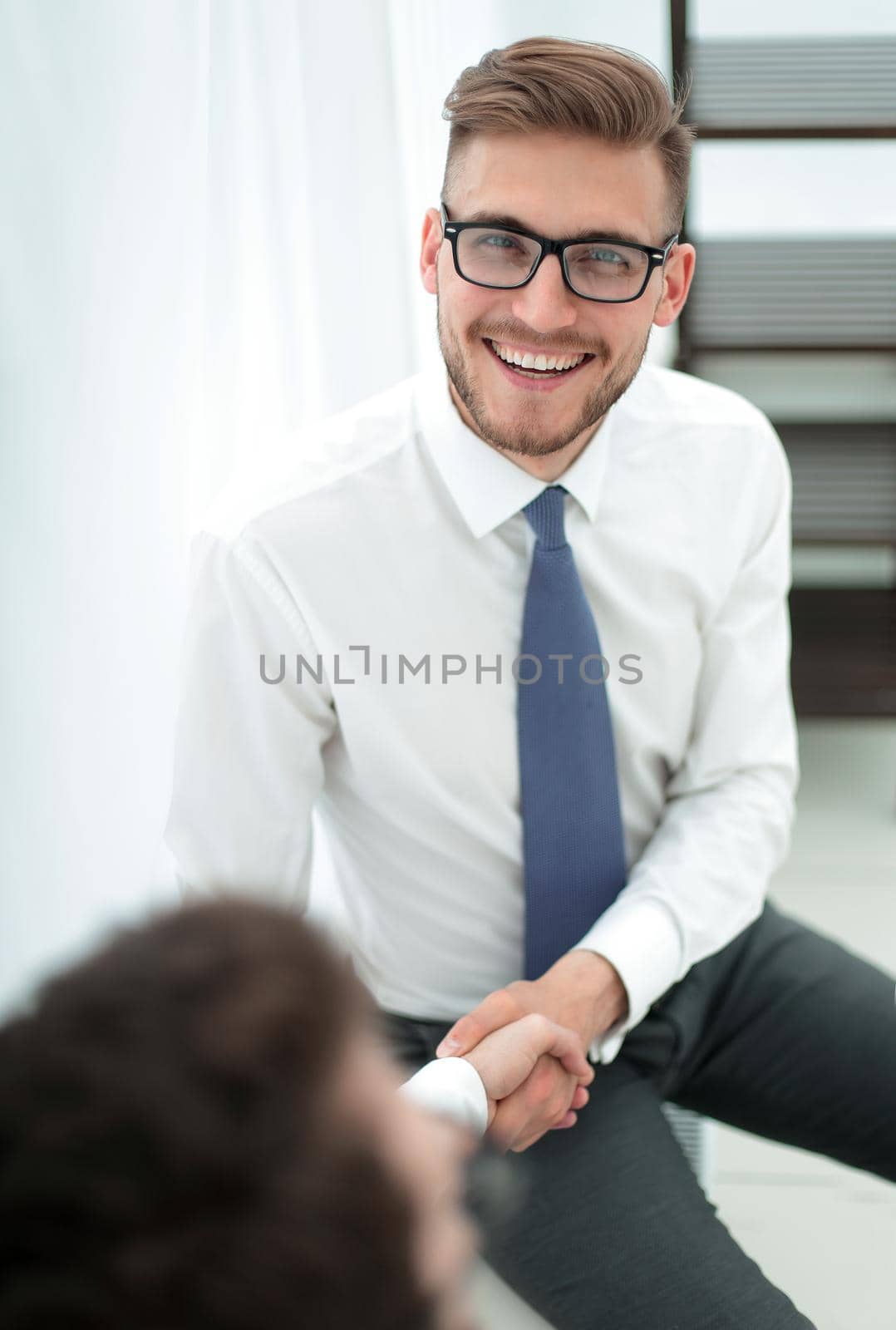 close up.welcome handshake of the company's employees .the concept of cooperation