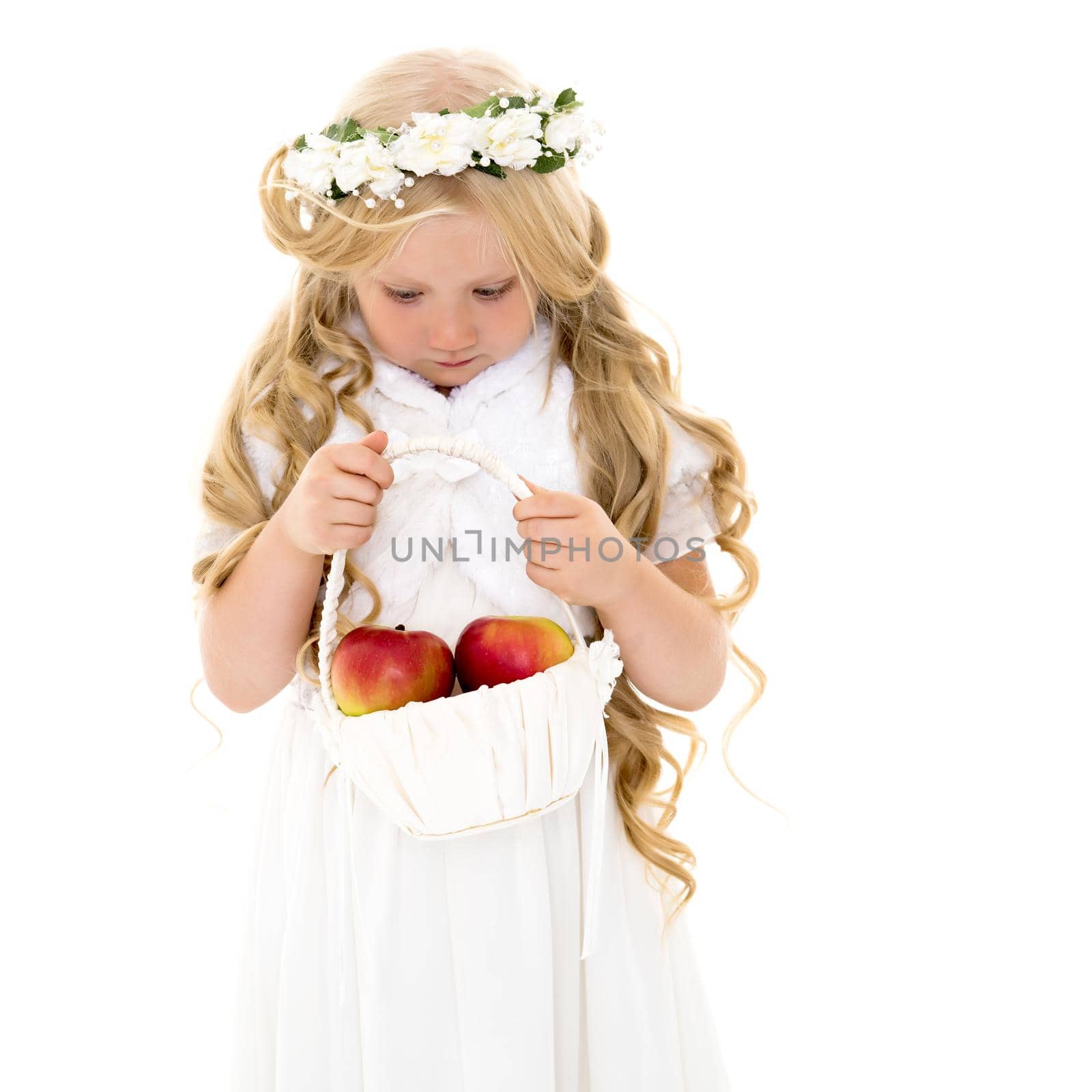 Little girl with a basket of apples. by kolesnikov_studio