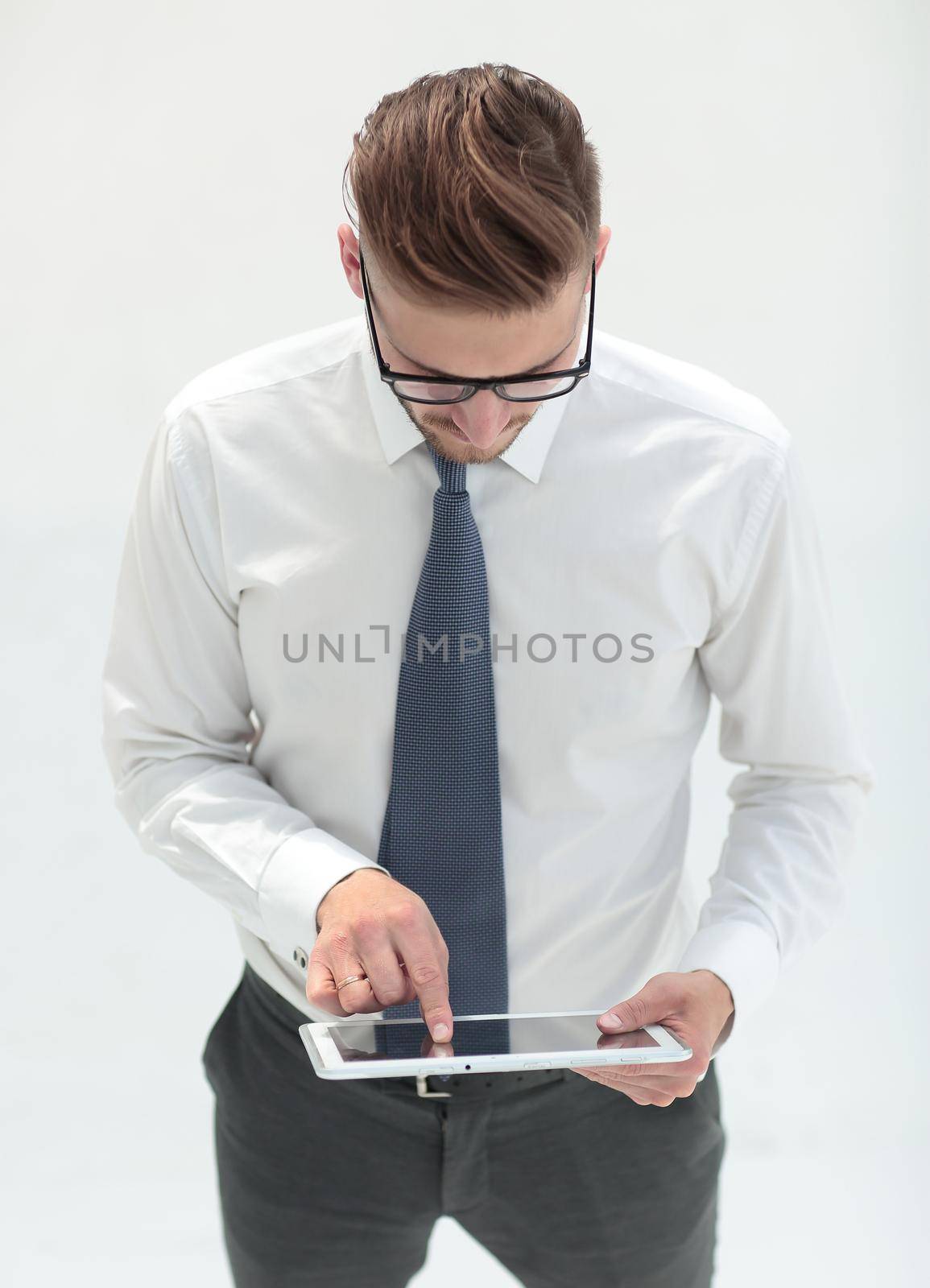 close up.modern business man by tapping the screen of digital tablet by asdf