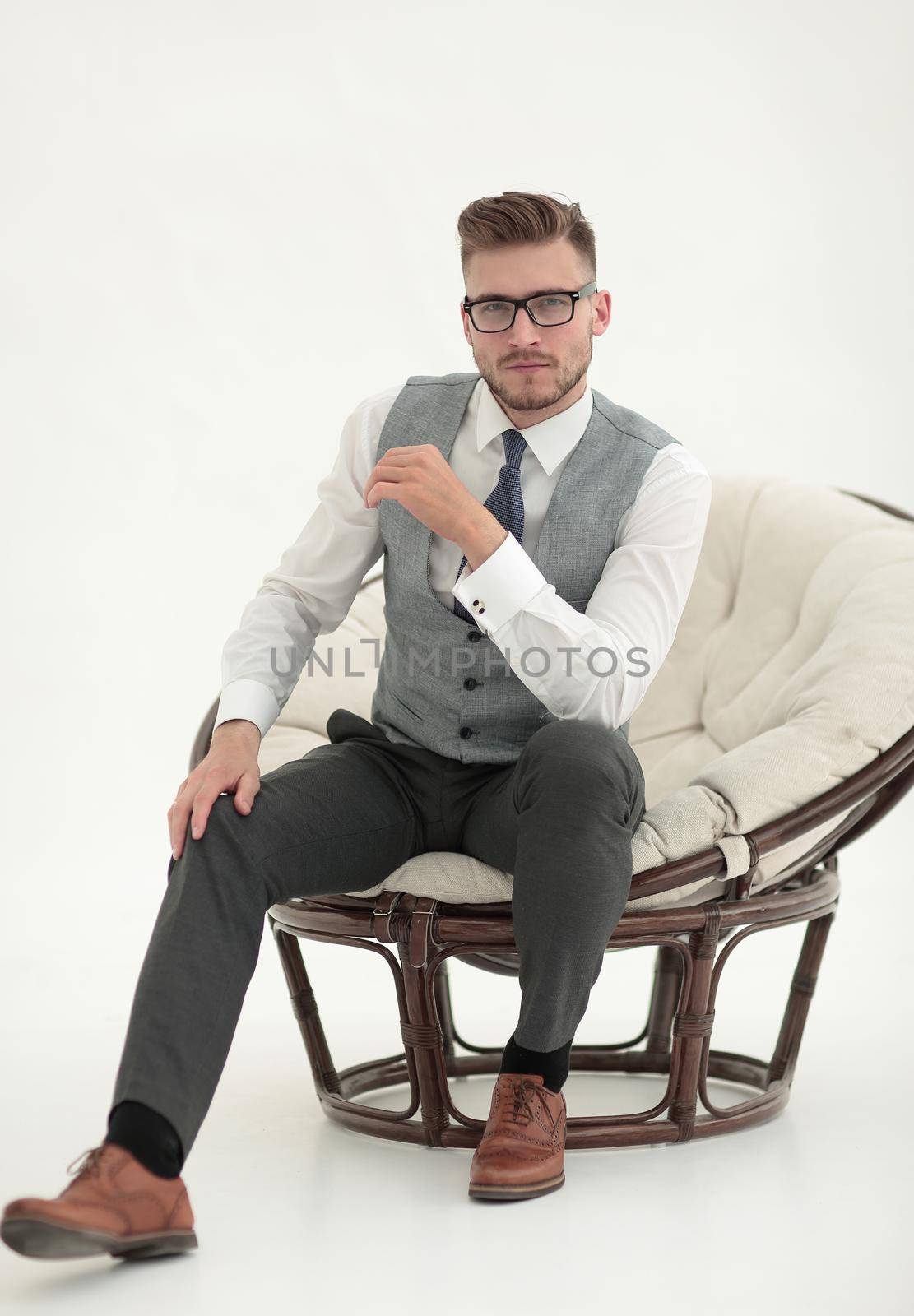close up.confident man sitting in a comfortable chair.photo with copy space