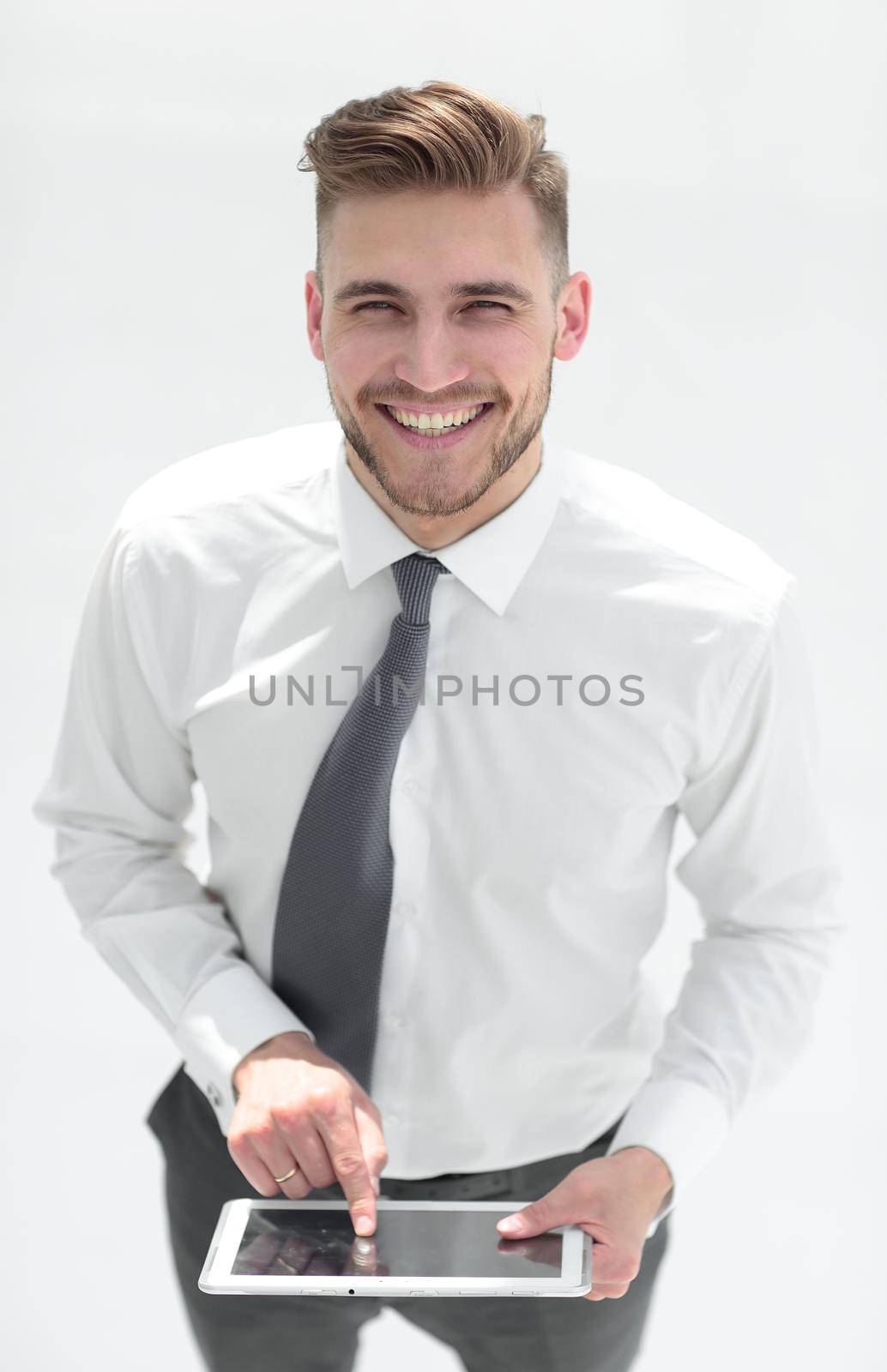 Confident man in shirt and tie with digital tablet.people and technology