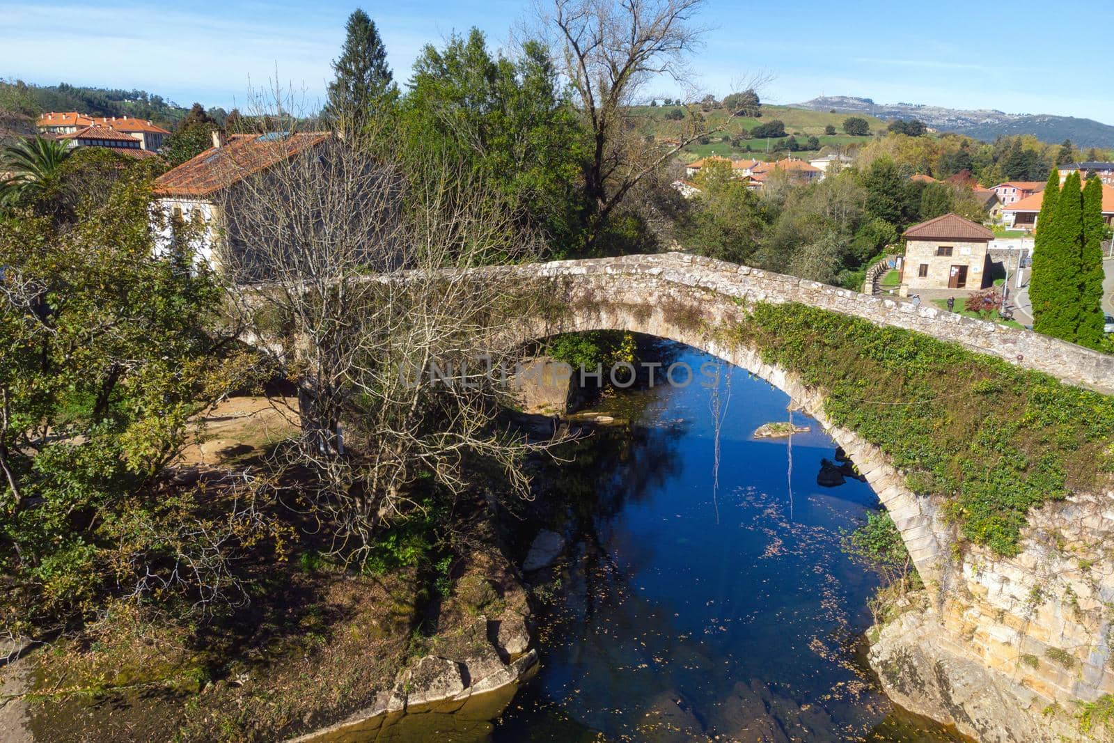 Aerial view of a scenic medieval bridge in Lierganes, Cantabria, Spain. by HERRAEZ