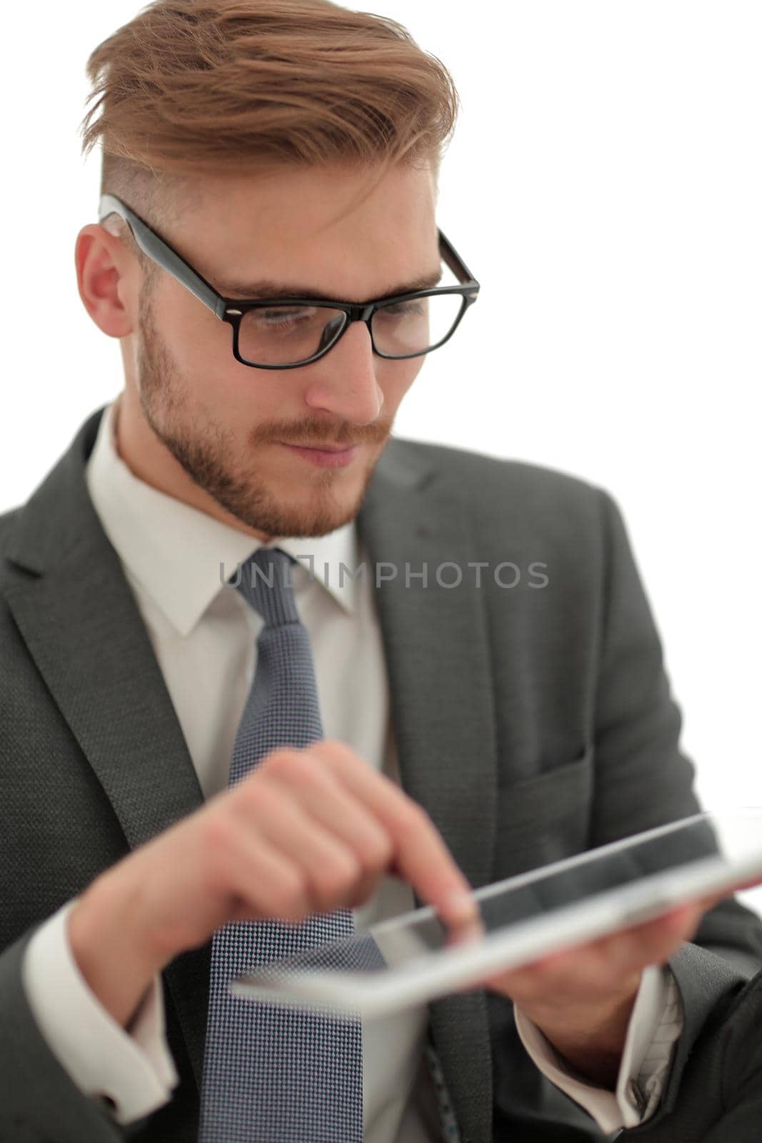 close up. successful businessman with digital tablet.people and technology.