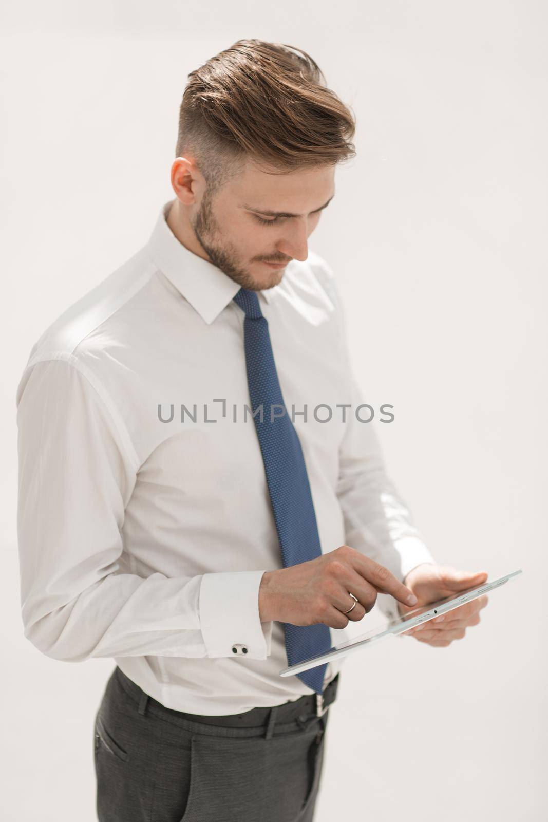 successful young businessman uses a new gadget.people and technology