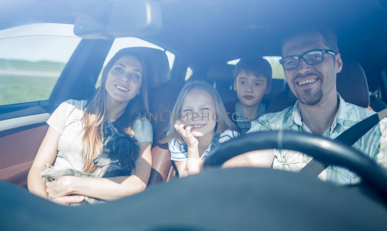 happy family travelling by car by asdf