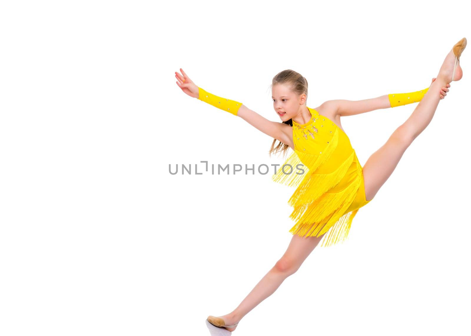 A little girl performs a gymnastic twine. The concept of fitness and sports. Isolated on white background.